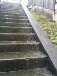 When it's really rainy, the steps to the main road are a waterfall!