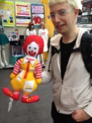 Sam looking disconcerted by this very strange McDonald's doll...